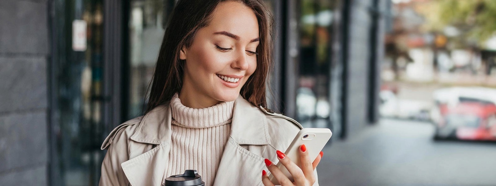Young woman using phone in the city