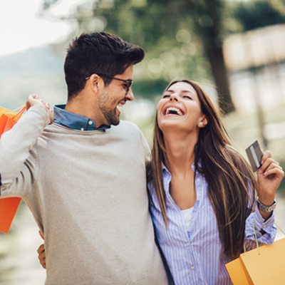 Young couple shopping and laughing